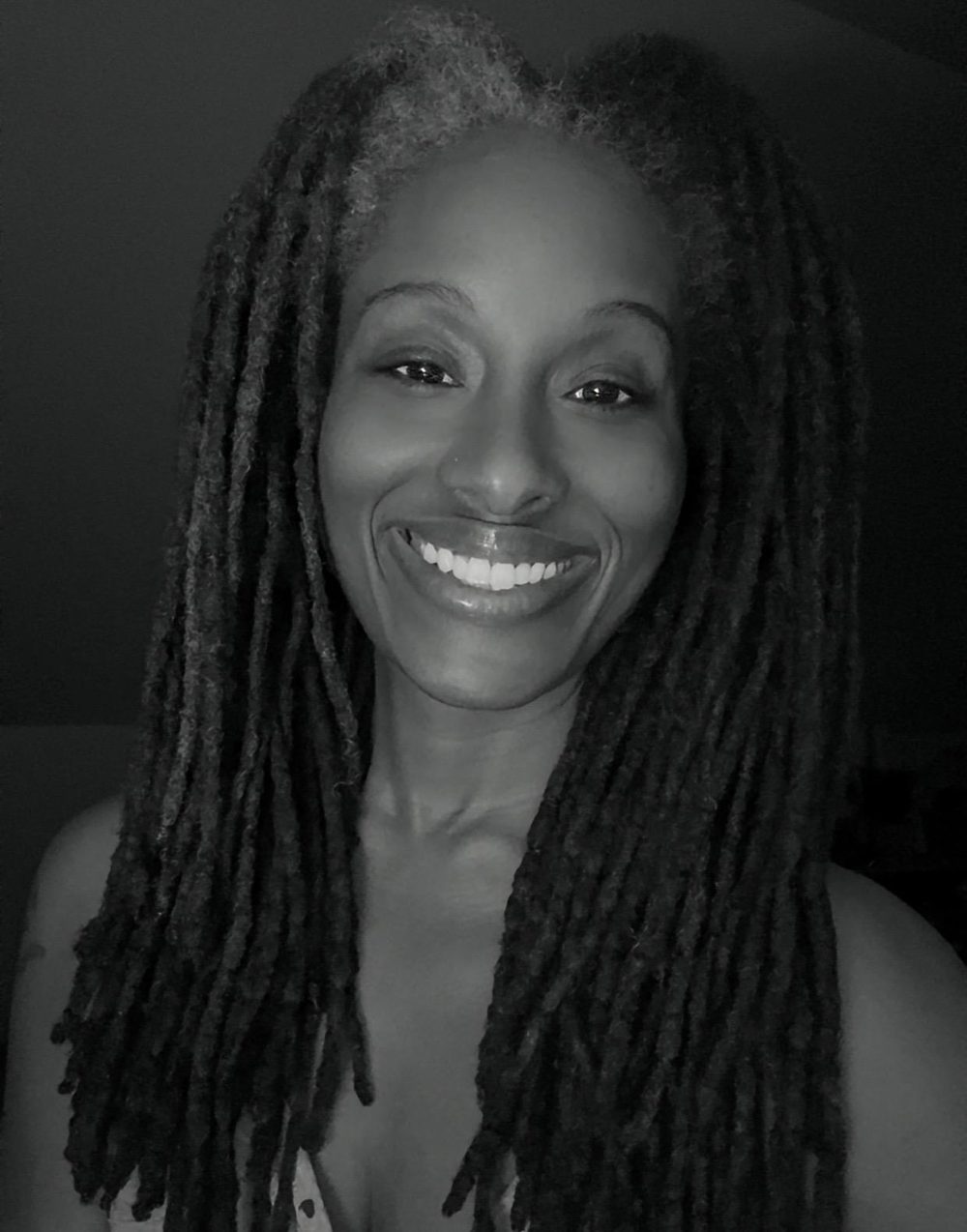 Black and white portrait of Izetta Henderson smiling